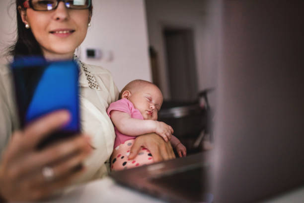 istock Young mother working and spending time with baby 1154987316