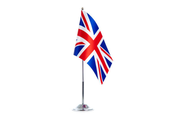 istock British Flag stands on a white background 1154987369