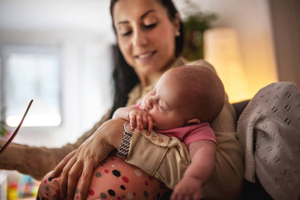 istock Young mother working and spending time with baby 1154987409