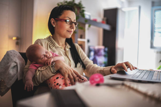 istock Young mother working and spending time with baby 1154987434