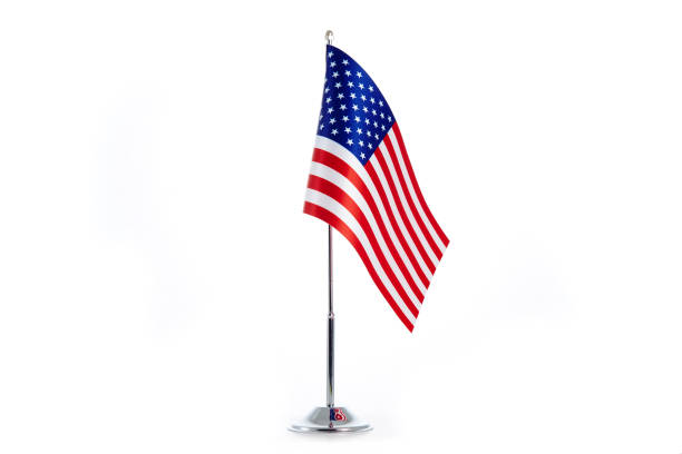 istock American Flag stands on a white background 1154987504