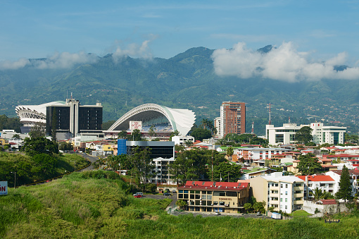 San Jose, Costa Rica - June 18, 2012: View to the National Stadium and residential buildings with mountains at the background in San Jose, Costa Rica.