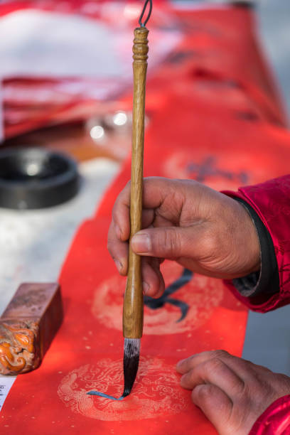 istock Hand Holding Chinese brush 1154992230