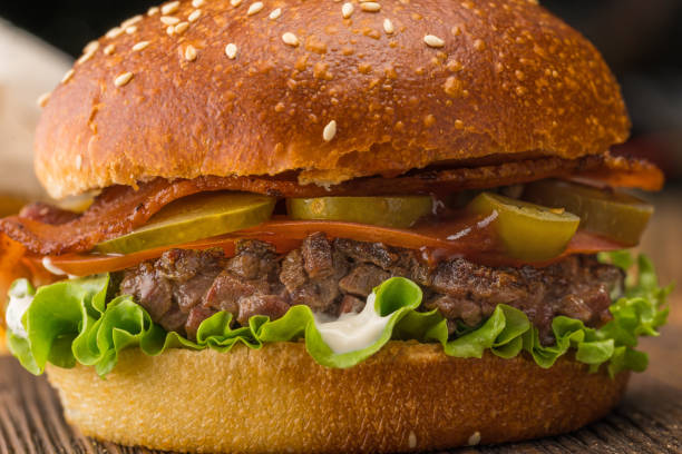 istock Burger with coarsely chopped meat, red sauce and potatoes 1154992741