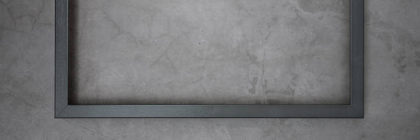istock Dark frame for painting on a gray cement textured background. 1154993369