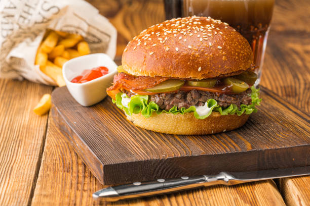 istock Burger with coarsely chopped meat, red sauce and potatoes 1154993426