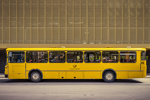 Nördlingen, Germany - June 1, 2019: Mercedes-Benz O 307 oldtimer public transport bus of the German Post at Nördlingen railway station.