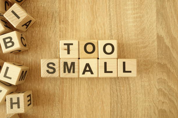 istock Text too small from wooden blocks on desk 1154996487