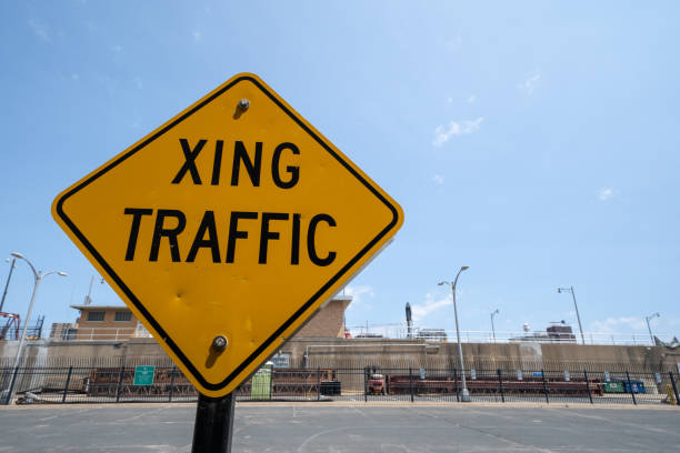 istock Sign for Crossing (XING) traffic, warning drivers 1154998409