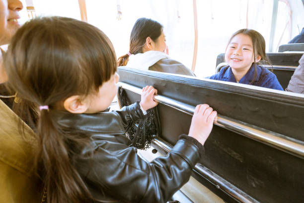istock two young girl laughing at each other 1154999864