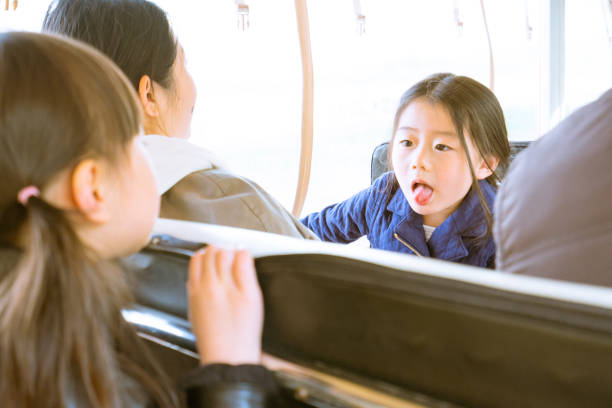 istock two young girl laughing at each other 1155000406