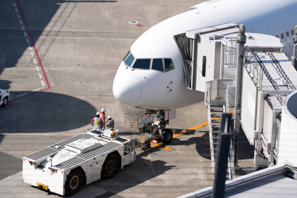 istock Airplane  at jet bridge in airport 1155000415