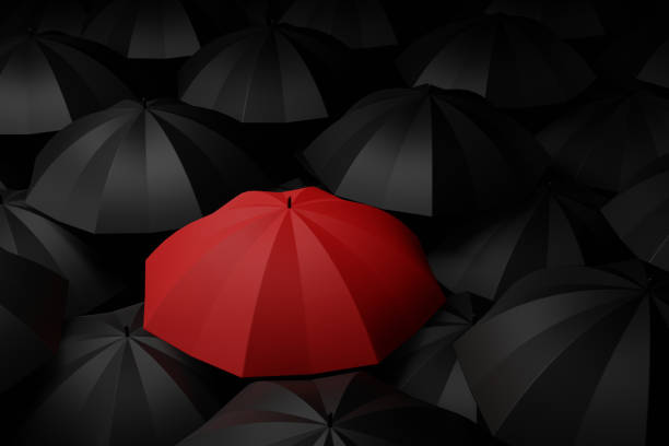 istock Red umbrella in the midst of black. Difference concepts. 3D rendering. 1155004373
