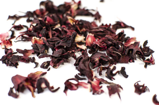 istock Hibiscus tea. Herbal tea.  Dry tea leaves isolated on white background 1155004402