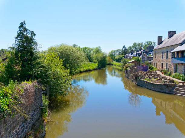istock The River Selune flows gently through Ducey, France 1155005213