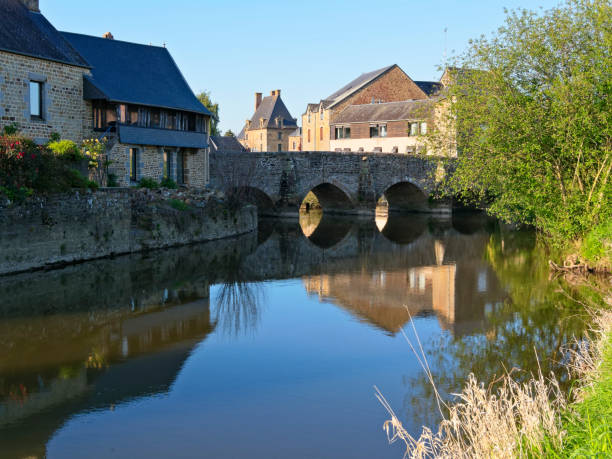 istock Stone bridge over the River Selune in Ducey, France 1155005246