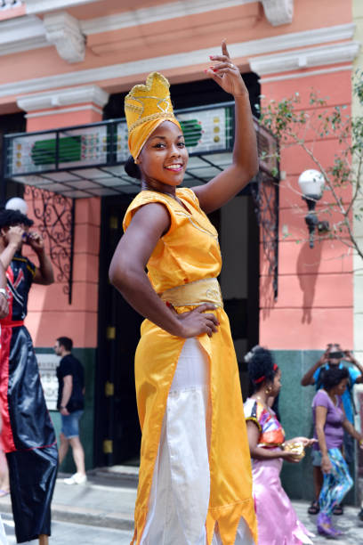 Havana, Cuba - May 29, 2024: A group of young Cuban artists dancing on a city sidewalk in the downtown district.