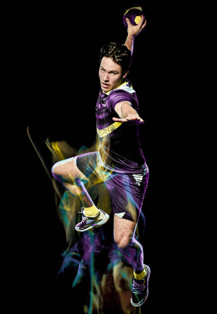 istock handball player young man isolated speed light painting 1155010228