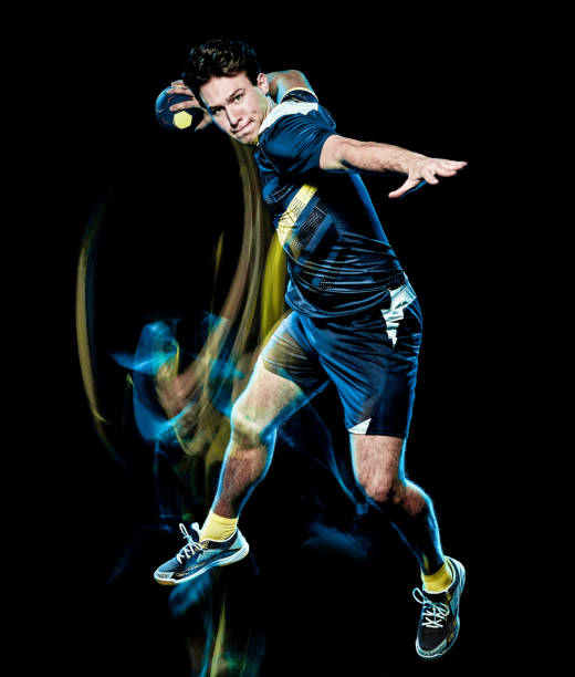 istock handball player young man isolated speed light painting 1155010247