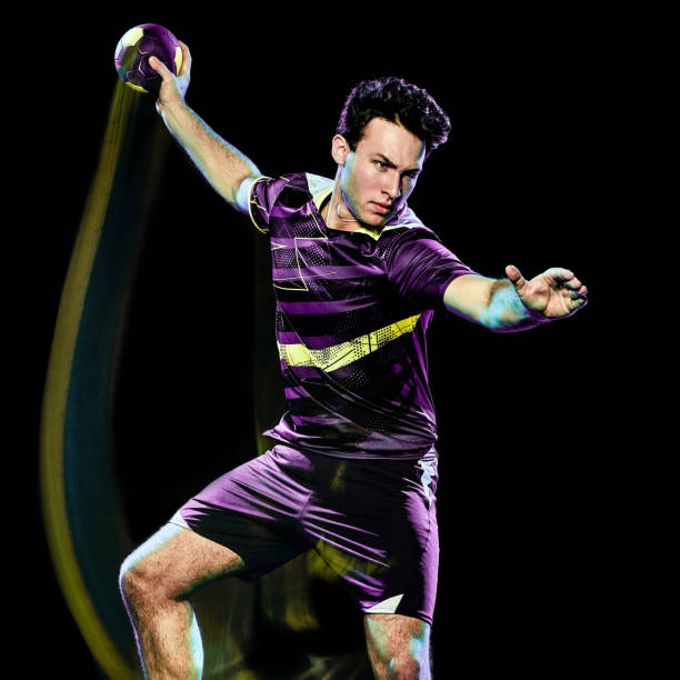istock handball player young man isolated speed light painting 1155010264