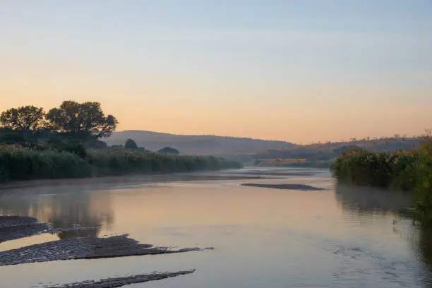 The Black Umfolozi River just after sunrise, iMfolozi, South Africa.
