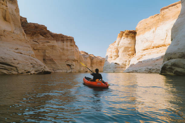 Lake Powell kayaking Kayaking through the old and wild waters of lake Powell lake powell stock pictures, royalty-free photos & images