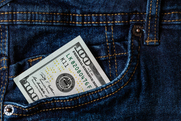istock 100 dollar banknote in jeans pocket 1155012982