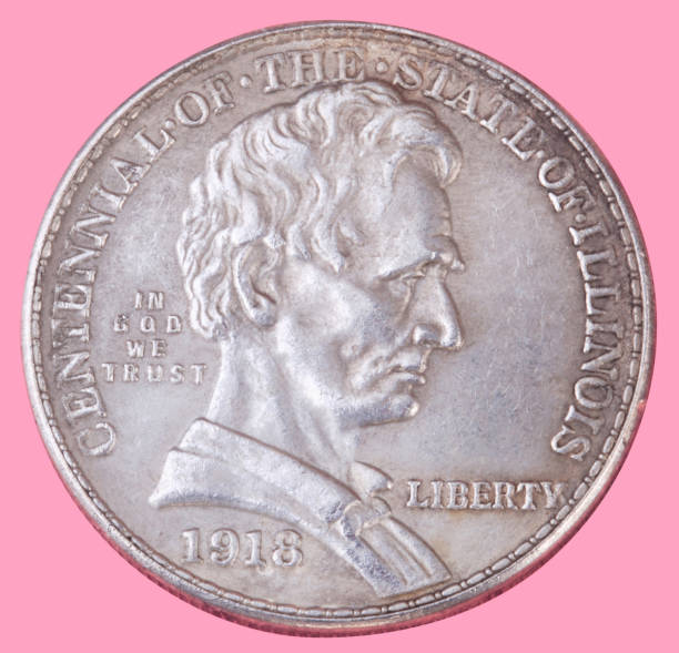 istock half dollar coin isolated on pink background 1155013223