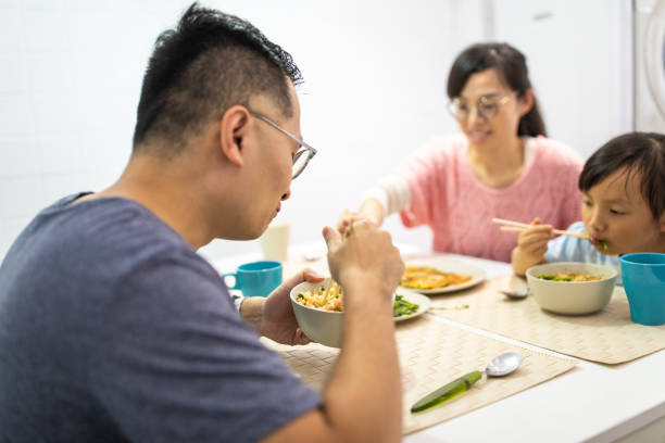 istock Married couple with daughter having breakfast at home 1155016261