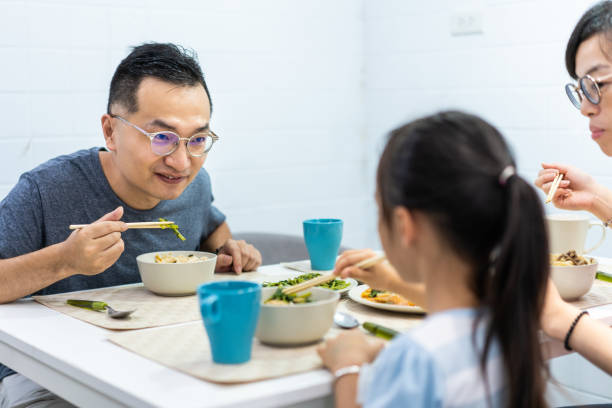 istock Taiwanese family enjoying breakfast together 1155016454