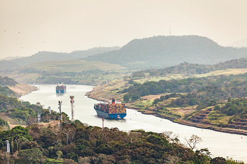 huge cargo container ships on the panama canal in panama.