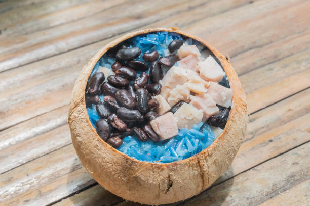 Sticky rice , black bean and taro  in coconut shell.
