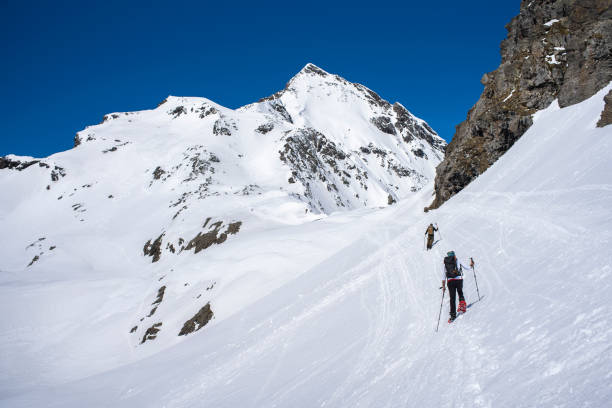 istock Alpinists walking on Snow With Snowshoes 1155023185