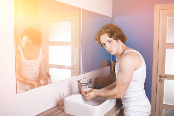istock Morning and hygiene. Attractive guy in the bathroom. 1155032569