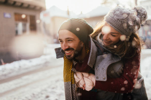 Winter love Romantic couple on a snowy day winter city stock pictures, royalty-free photos & images
