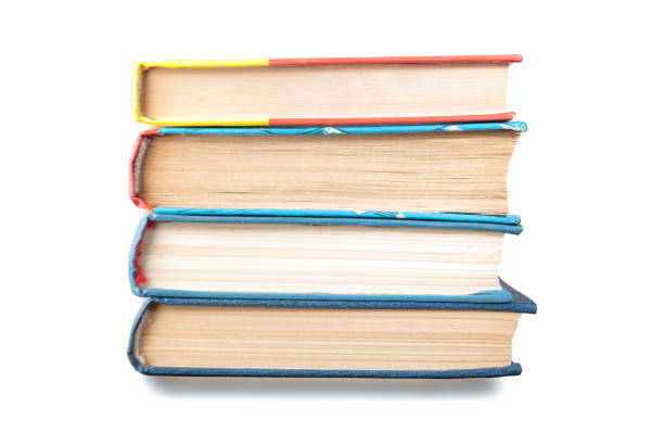 istock Group of books stacked vertically isolated on white 1155033900
