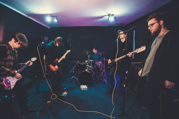 istock Young mails in music band. 1155034313