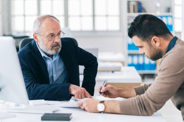 istock Senior male manager working with his colleague 1155036925