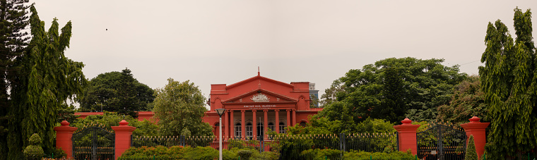 Panoramic view of Karnataka high court covered with green trees