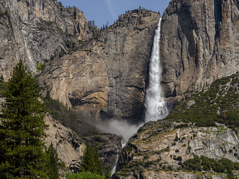 Yosemite Falls in Yosemite National Park California. A popular destination for viewing a magnificent waterfall. One of the most popular features at Yosemite Park. Lots of water due to spring runoff.