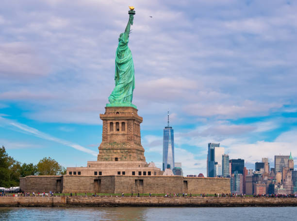 istock statue of liberty and Manhattan skyline 1155039036