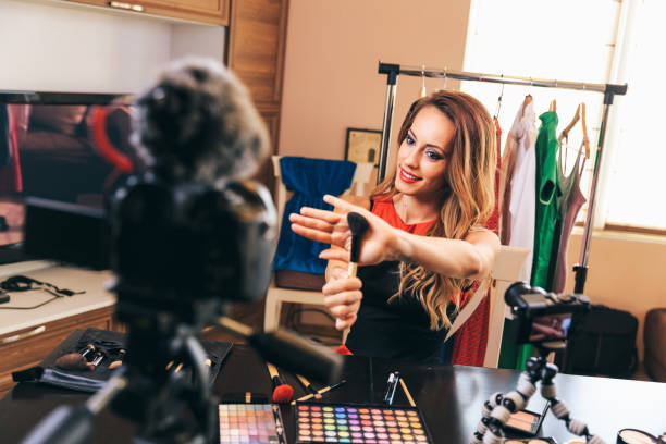 istock Female vlogger presenting make-up products 1155041690