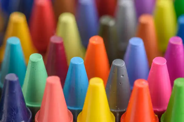 Close up of colorful and pastel crayons