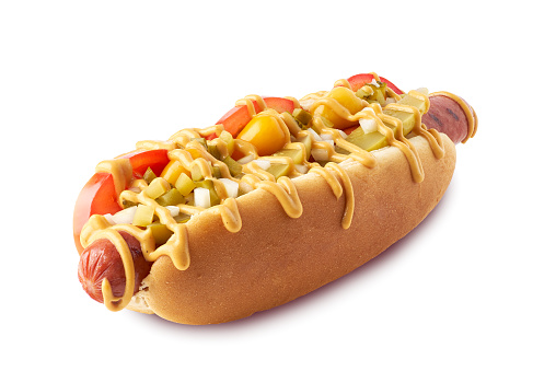 Hot dog with pickles and tomatoes isolated on white background. Clipping path included