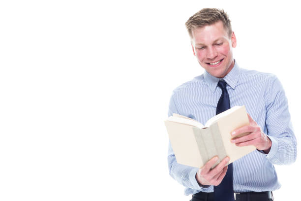 istock Handsome attractive man in business attire on white background - holding book 1155043169
