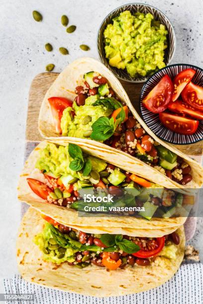 Vegan Tortillas With Quinoa Asparagus Beans Vegetables And Guacamole Stock Photo - Download Image Now