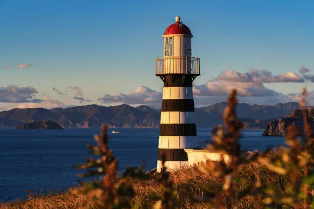 Petropavlovsky Lighthouse (founded in 1850) - oldest lighthouse in Russian Far East, located on Kamchatka Peninsula on shore of Avacha Gulf in Pacific Ocean, vicinity of Petropavlovsk-Kamchatsky City.