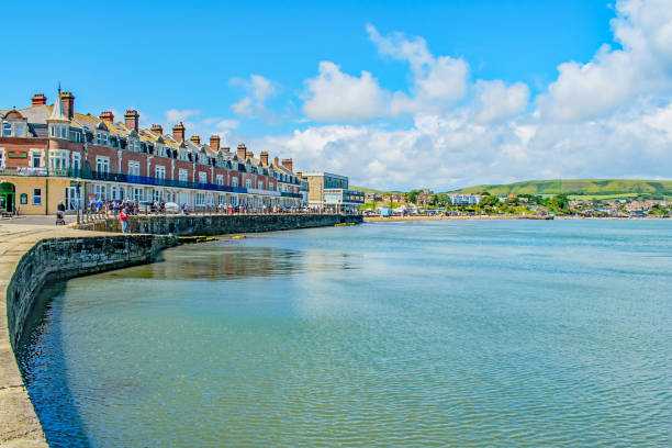 the rippling waters at swanage bay on a summers day - swanage imagens e fotografias de stock