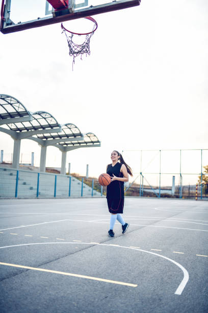 istock Female Basketball Player Getting Ready To Score A Point 1155051173