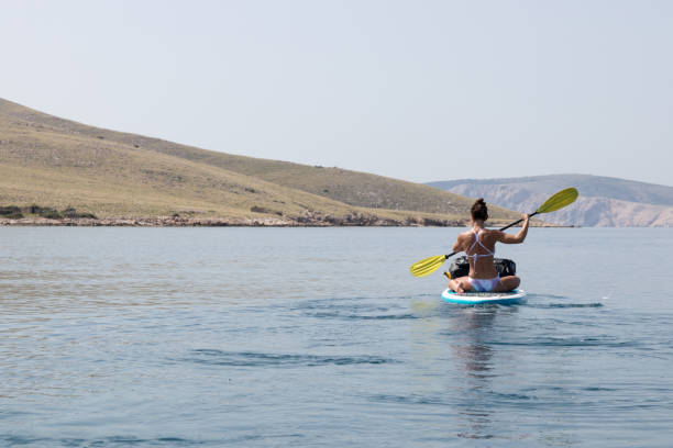 istock Woman paddling 1155051243